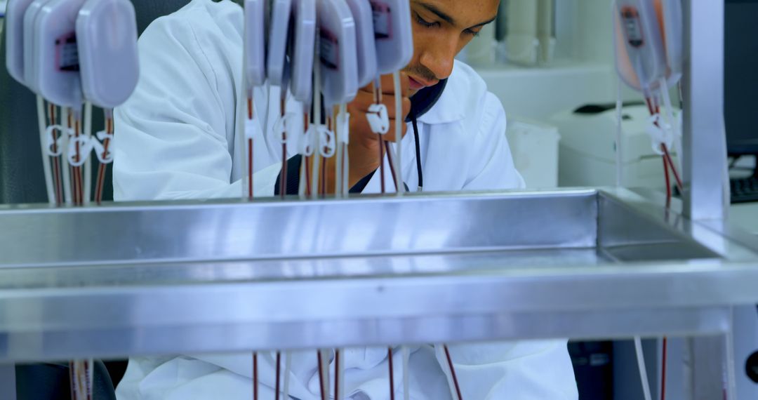 Male Scientist Conducting Blood Research in Laboratory - Free Images, Stock Photos and Pictures on Pikwizard.com