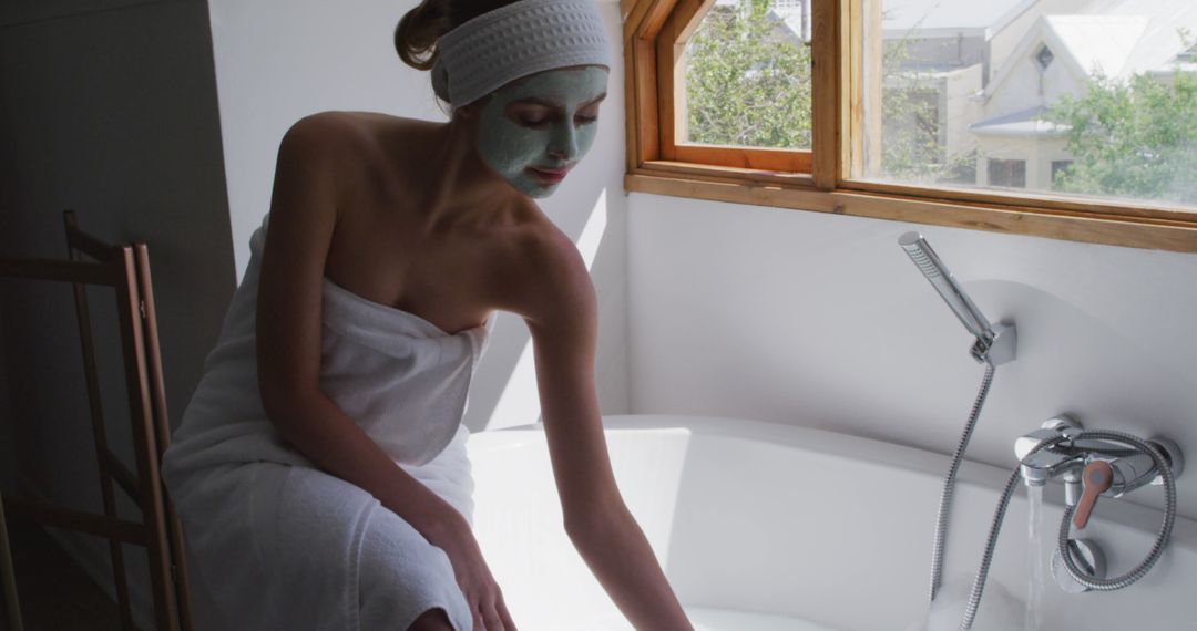 Young Woman Enjoying Wellness Routine with Face Mask in Modern Bathroom - Free Images, Stock Photos and Pictures on Pikwizard.com