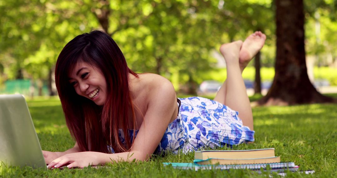 Young Woman Studying Outdoors with Laptop in Park - Free Images, Stock Photos and Pictures on Pikwizard.com