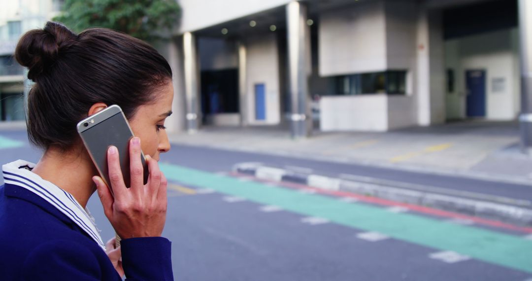 Businesswoman Talking on Smartphone in Urban Street - Free Images, Stock Photos and Pictures on Pikwizard.com