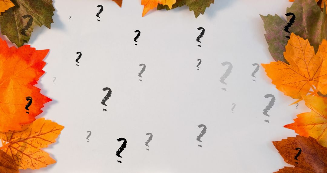 Festive Autumn Leaves with Floating Question Marks