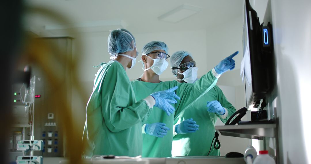 Doctors Analyzing Medical Data in Hospital Operating Room - Free Images, Stock Photos and Pictures on Pikwizard.com