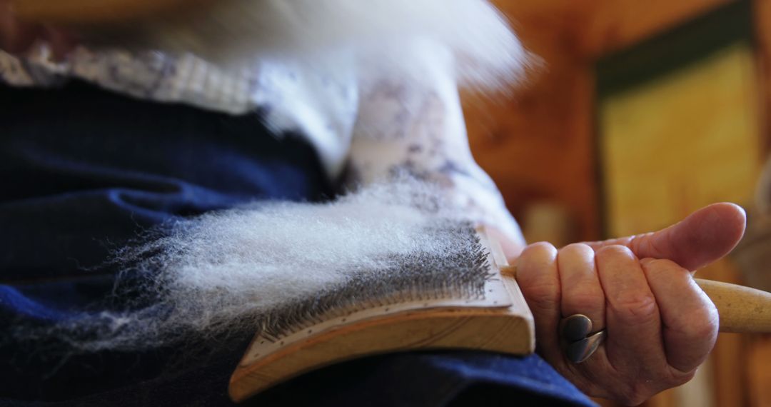 Close-Up of Worker Carding Wool for Spinning - Free Images, Stock Photos and Pictures on Pikwizard.com