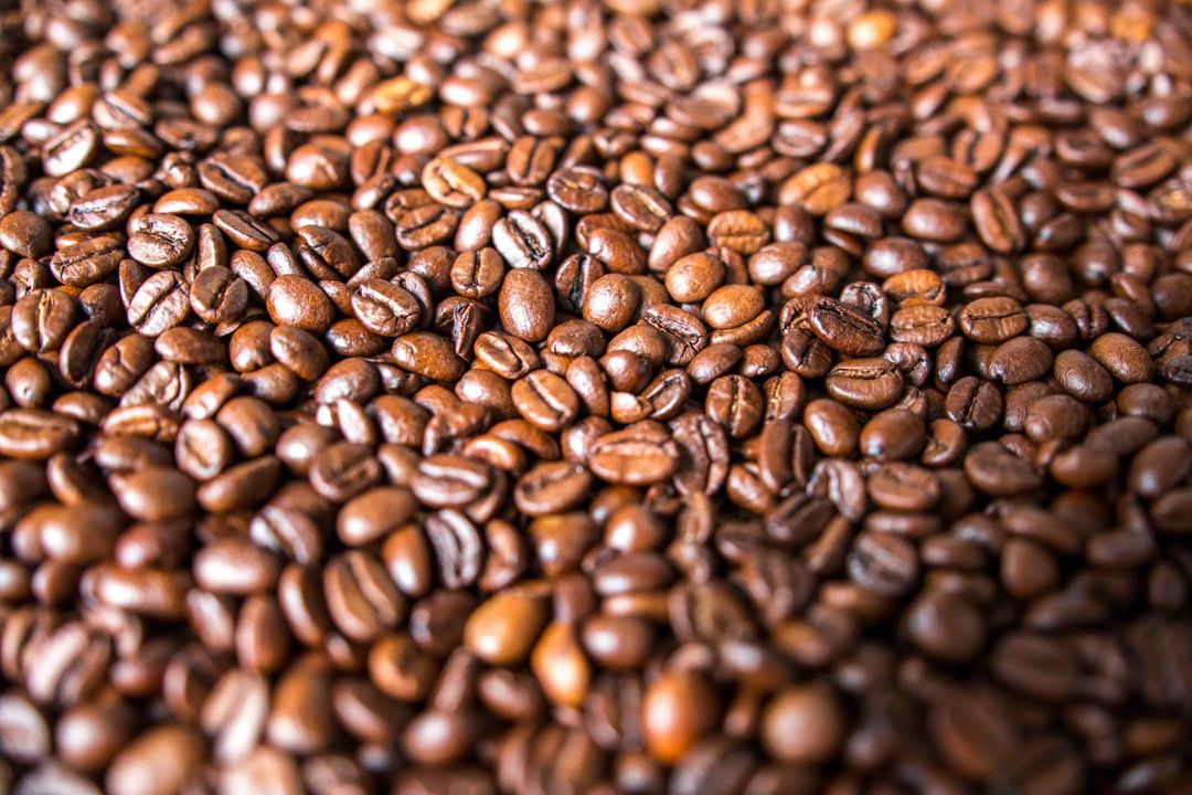 Close-up of roasted coffee beans background - Free Images, Stock Photos and Pictures on Pikwizard.com