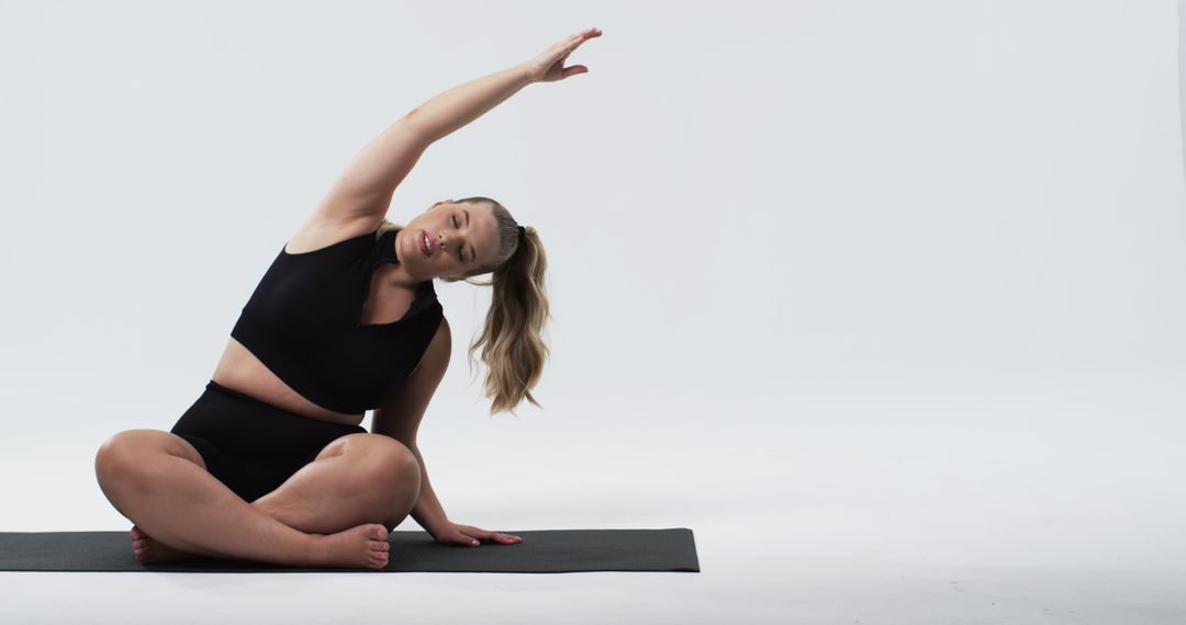 Confident Plus Size Woman Practicing Yoga Stretch