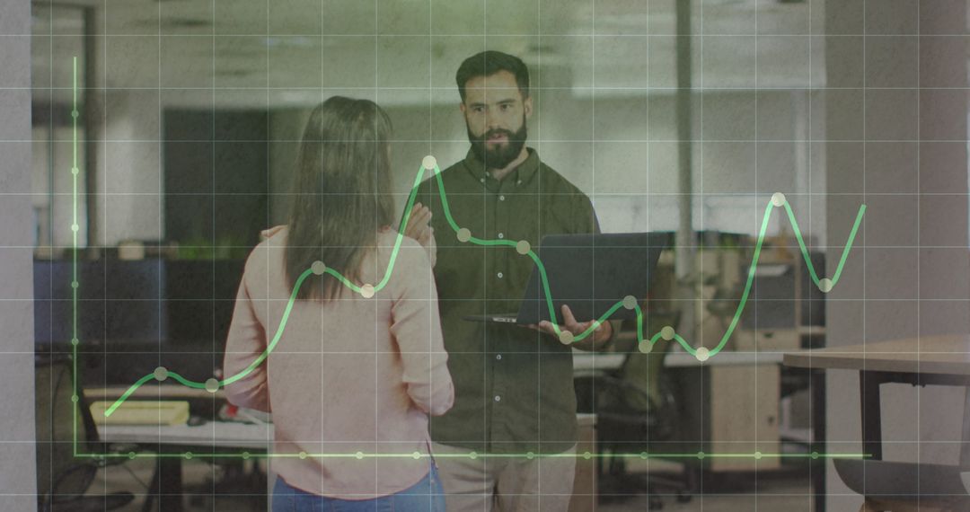 Business Professionals Discussing Financial Data in Office