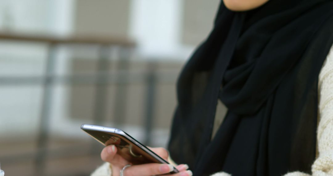 Woman Wearing Black Hijab Browsing Smartphone - Free Images, Stock Photos and Pictures on Pikwizard.com