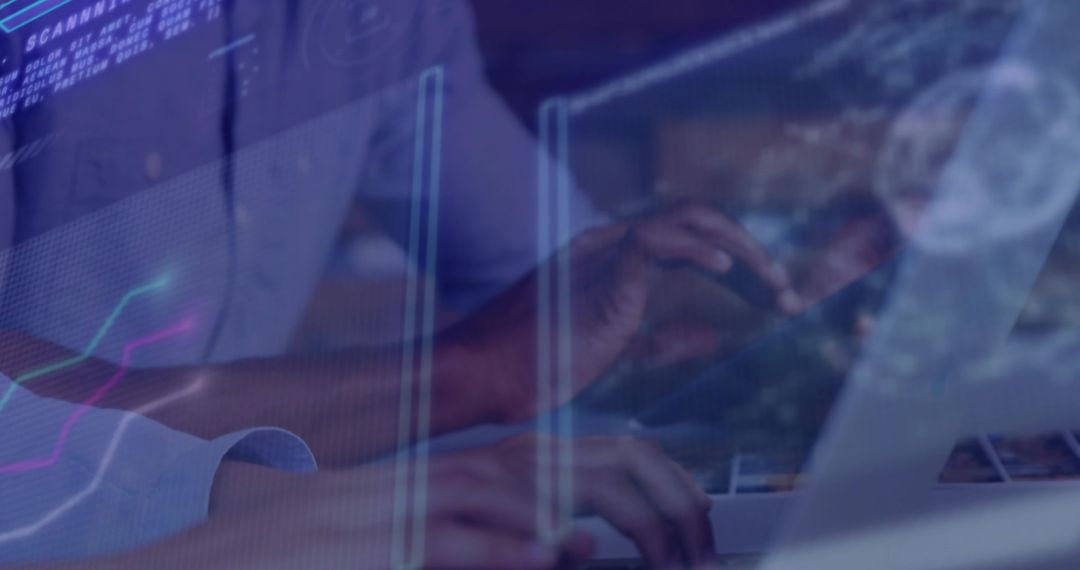 Hands Typing on Laptop with Graphical Data Interface Overlay