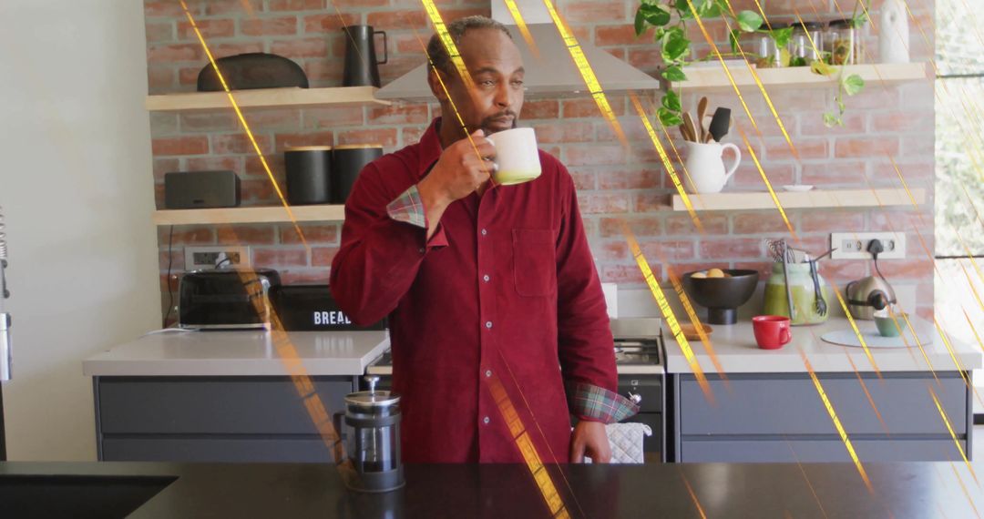 Man Enjoying Morning Beverage in Modern Rustic Kitchen Setting