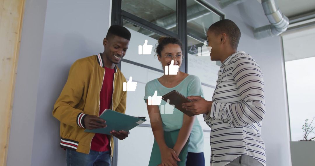 Diverse Team Collaborating in Modern Workspace with Thumbs-Up Icons