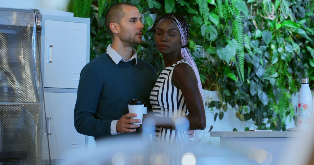 Diverse Colleagues Bonding in Office Break Room