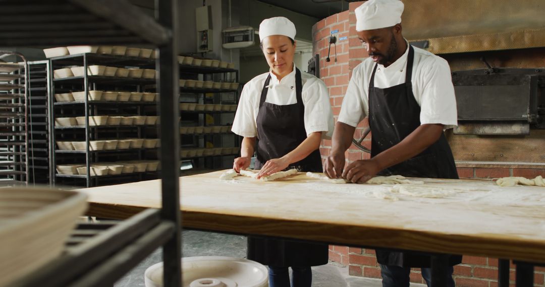 Two Chefs Preparing Dough in Bakery Kitchen - Free Images, Stock Photos and Pictures on Pikwizard.com