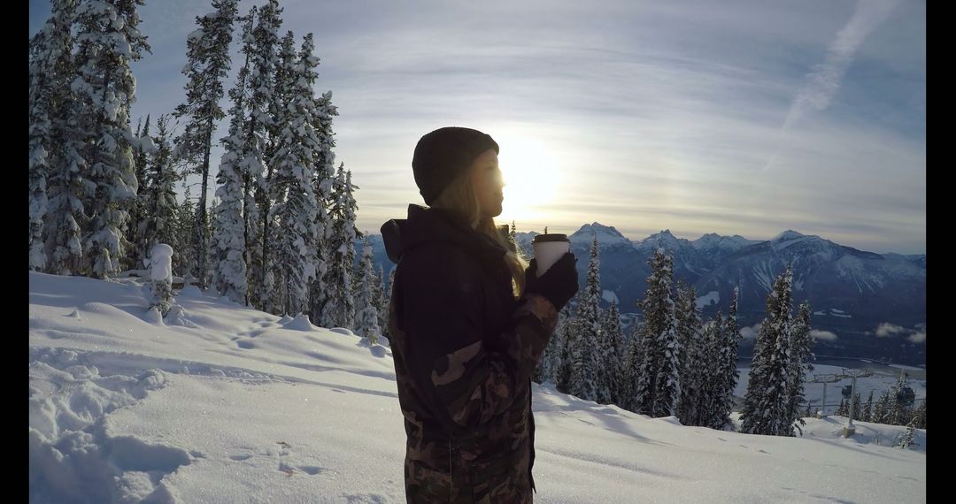 Woman Enjoying Morning Coffee on Snowy Mountain Landscape - Free Images, Stock Photos and Pictures on Pikwizard.com