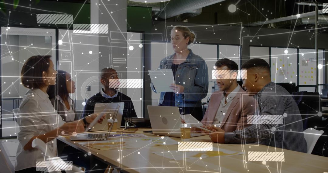 Collaborative Team Reviewing Project with Data Overlay in Modern Office