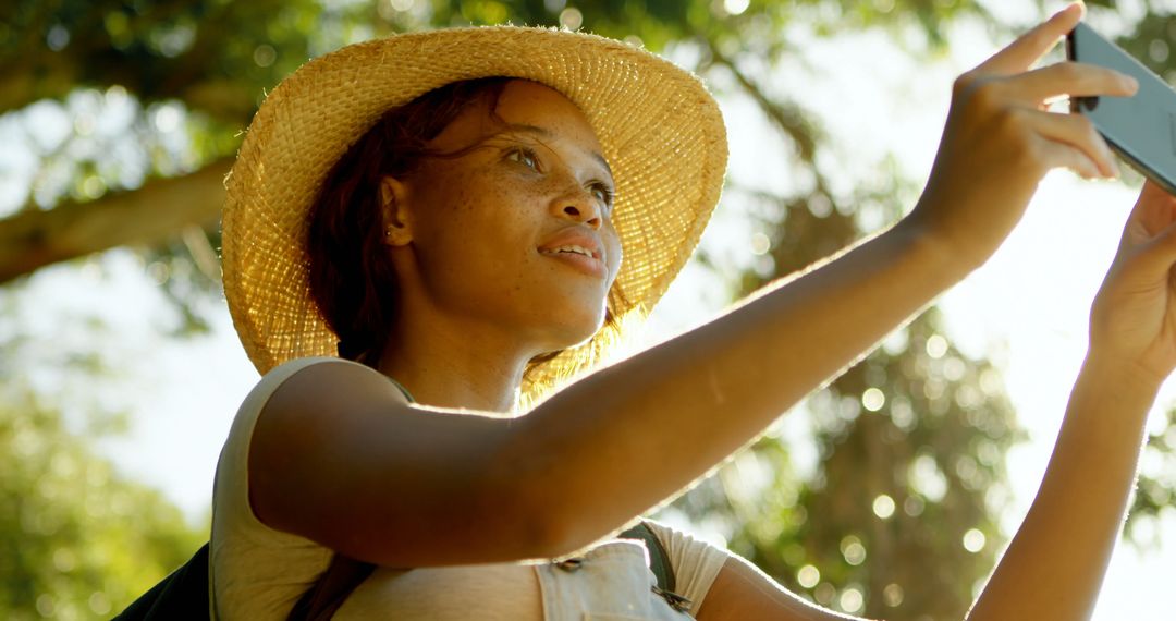 Young woman taking selfie with smartphone outdoors - Free Images, Stock Photos and Pictures on Pikwizard.com