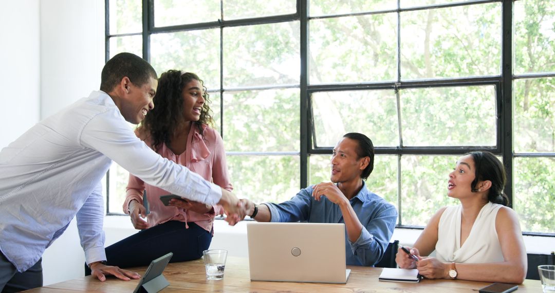 Diverse Colleagues Collaborating Successfully in Modern Office
