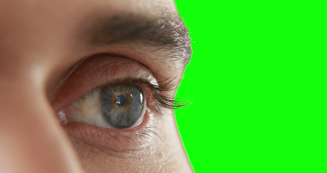 Close-up of Blue Eye with Green Background - Free Images, Stock Photos and Pictures on Pikwizard.com