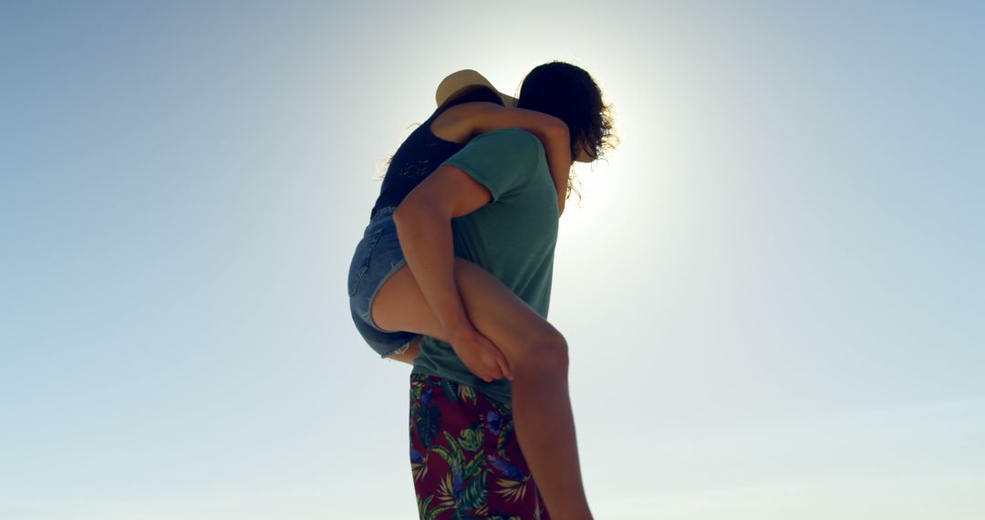 Couple Enjoying Beach Vacation Piggyback Ride - Free Images, Stock Photos and Pictures on Pikwizard.com