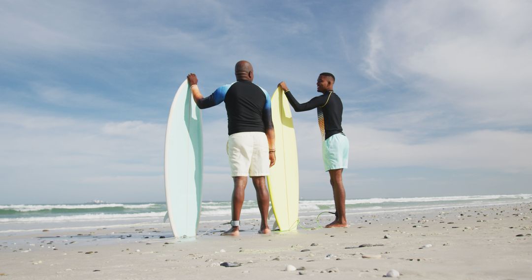 Two Male Surfers on Beach Holding Surfboards Ready for Waves - Free Images, Stock Photos and Pictures on Pikwizard.com