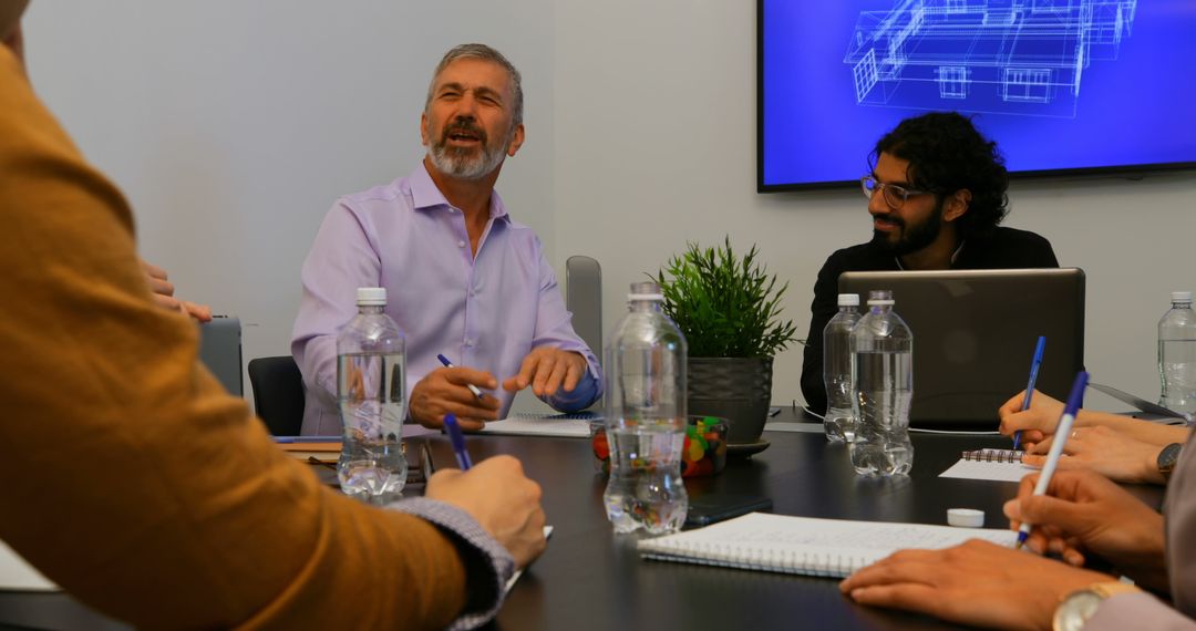 Diverse Professionals Collaborating in Office Meeting with Blueprint Display