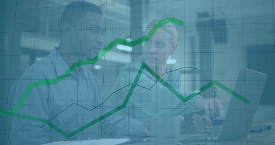 Office Professionals Collaborating on Data Analysis with Graphs