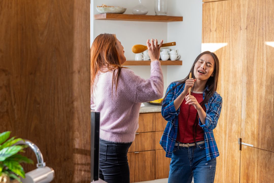 Family Bonding: Back-to-Back Singing Session in Kitchen