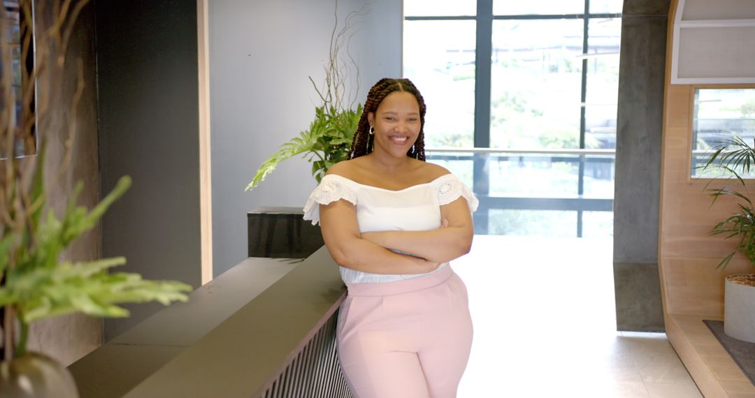 Confident Businesswoman Standing in Modern Office Lobby