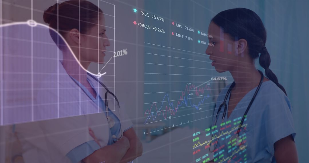 Female Doctors Analyzing Financial Data in Medical Setting