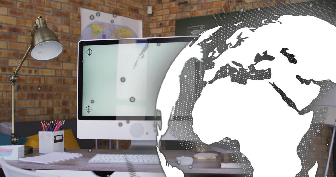 Modern workspace featuring all-in-one desktop with globe overlay in warm brick office