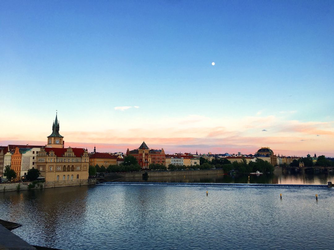 Scenic View of Historic European City Skyline and River at Sunset - Free Images, Stock Photos and Pictures on Pikwizard.com