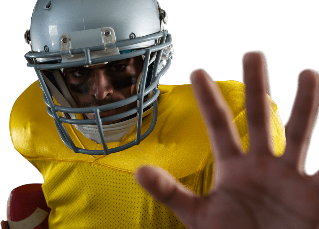 Focused Football Player in Yellow Jersey Making Gesture Transparent Background
