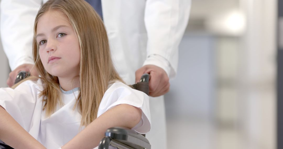 Doctor Caring for Young Patient in Wheelchair at Hospital - Free Images, Stock Photos and Pictures on Pikwizard.com