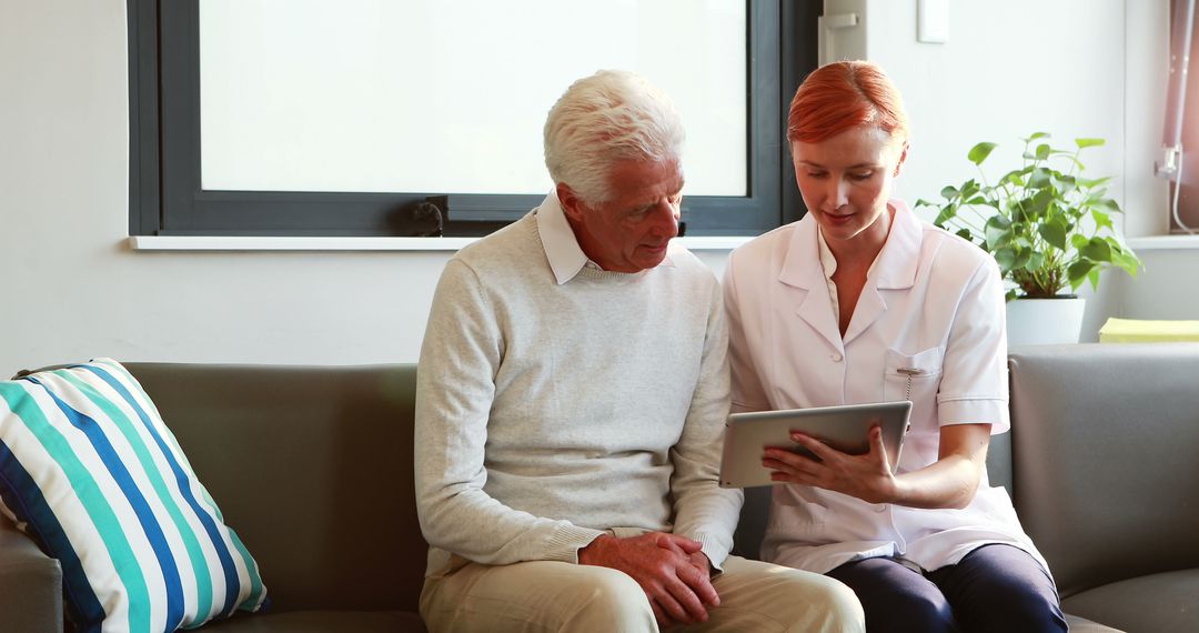 Caregiver and Senior Man Discussing Medical Records on Tablet - Free Images, Stock Photos and Pictures on Pikwizard.com