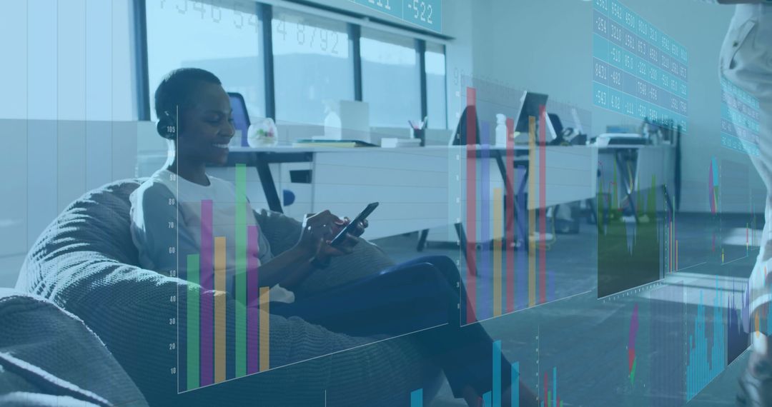Office Workers Analyzing Virtual Data on Beanbags in Modern Workspace