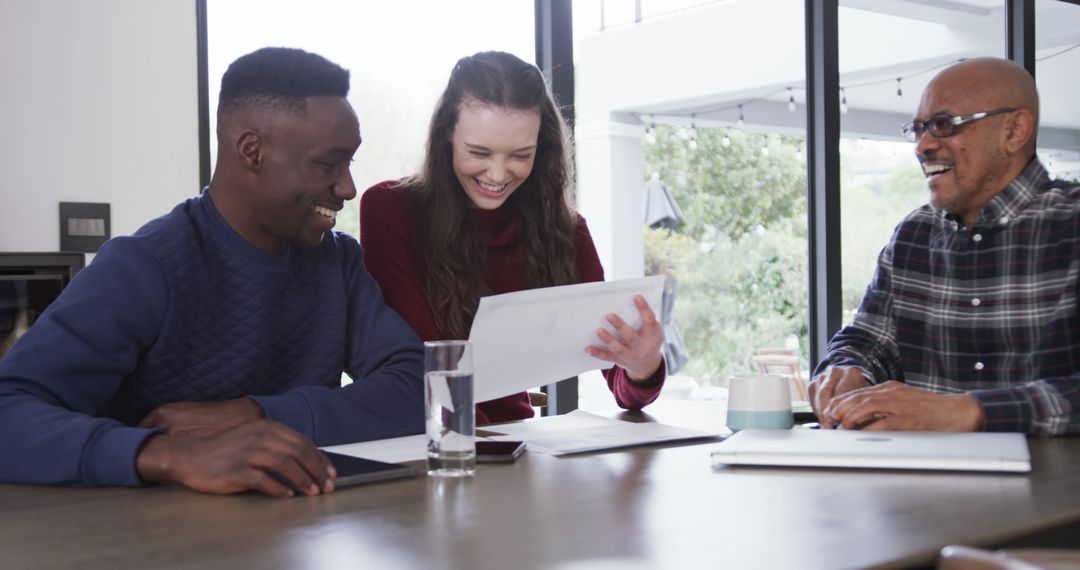 Happy Diverse Couple Consulting with Financial Advisor at Home
