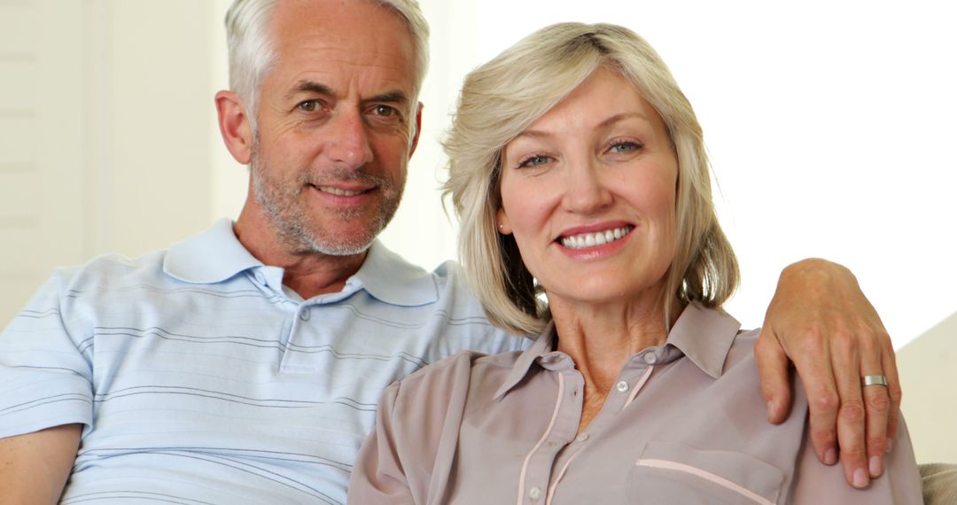 Senior Couple Relaxing on Couch at Home