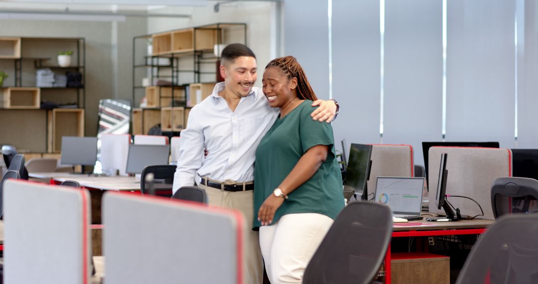 Colleagues Sharing Moment of Celebration in Modern Office