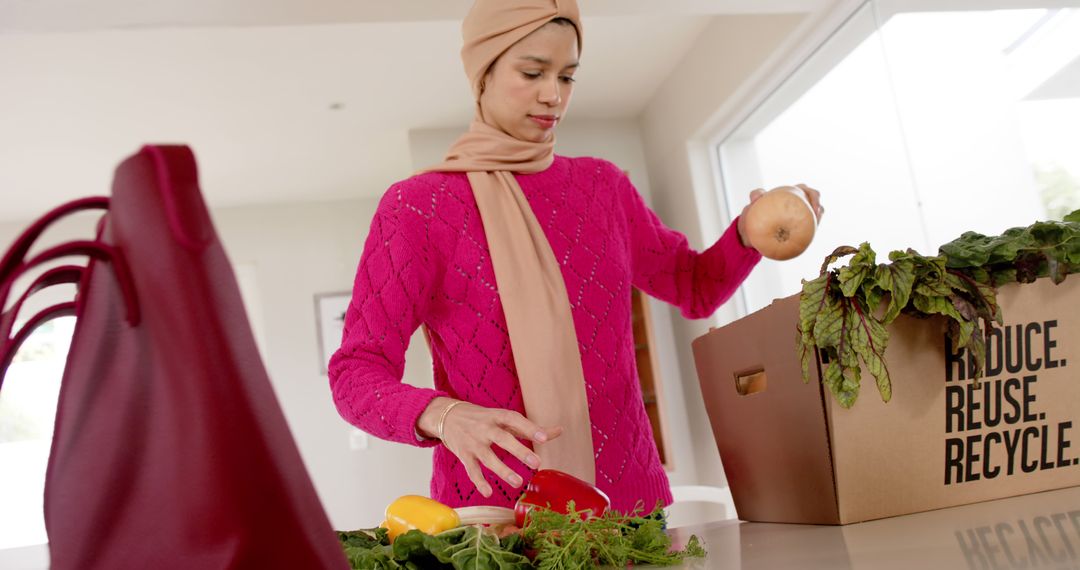 Woman Unpacking Groceries at Home with Reusable Bag - Free Images, Stock Photos and Pictures on Pikwizard.com