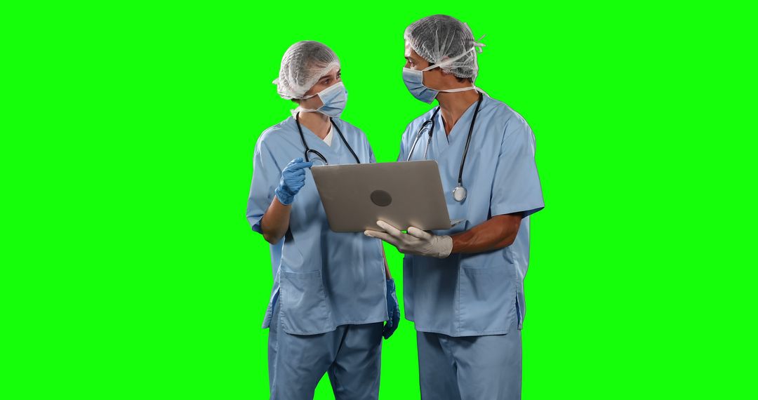 Two Medical Professionals Discussing Patient Data on Green Screen Background - Free Images, Stock Photos and Pictures on Pikwizard.com