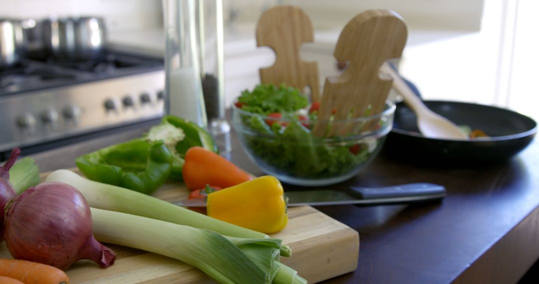 Kitchen Counter with Fresh Vegetables and Bowl of Salad for Cooking Inspiration - Free Images, Stock Photos and Pictures on Pikwizard.com