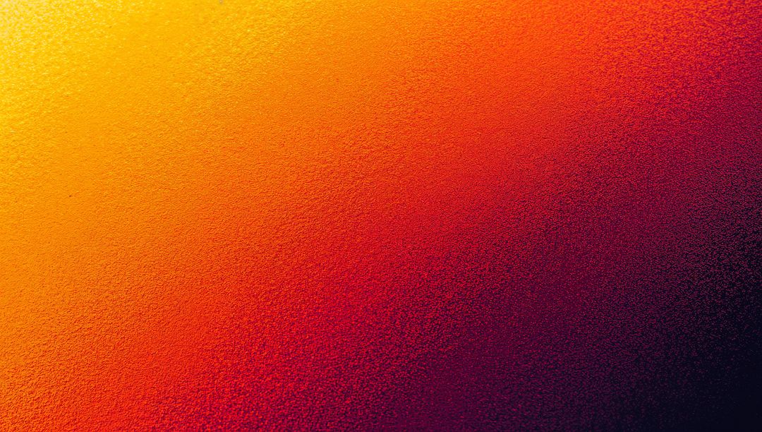 Vibrant metallic gradient shifting yellow to deep purple with subtle grain texture