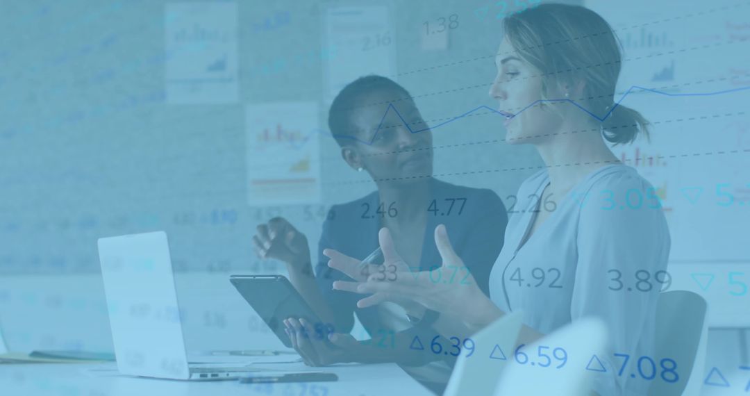 Collaborative Colleagues Analyzing Data with Technology in Modern Office