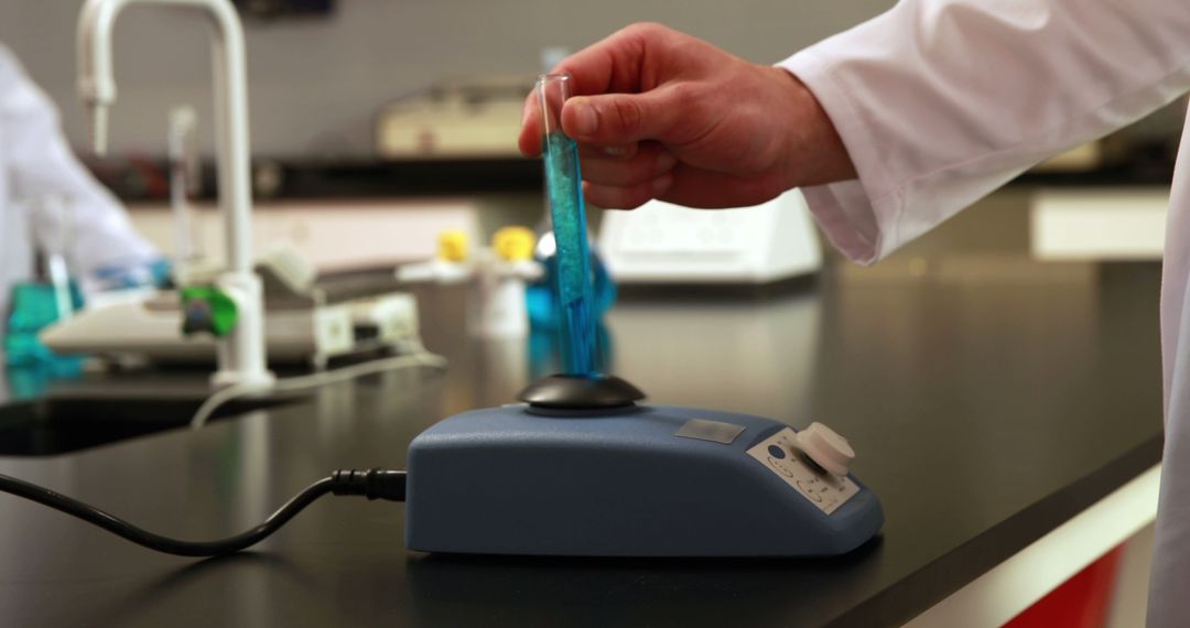 Scientist Using Laboratory Equipment to Mix Chemicals - Free Images, Stock Photos and Pictures on Pikwizard.com