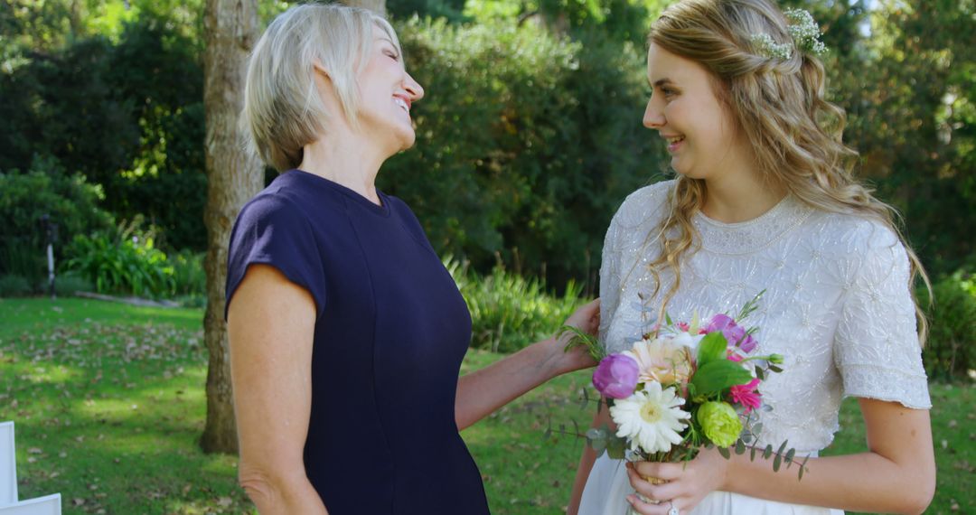 Joyful Moment Between Mother and Bride in Garden Wedding - Free Images, Stock Photos and Pictures on Pikwizard.com