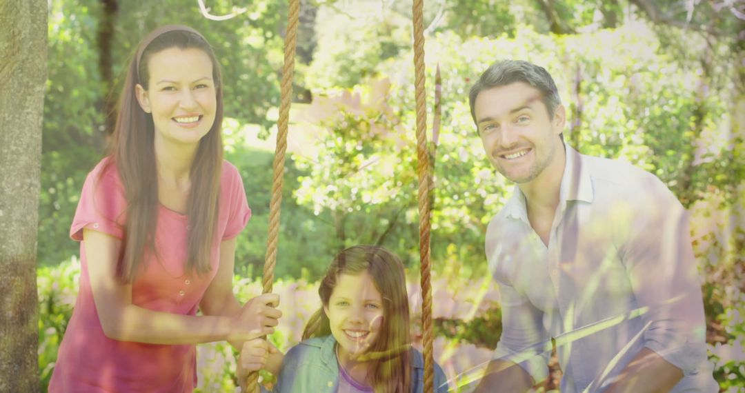 Joyful Family Enjoying Swingtime in Lush Garden