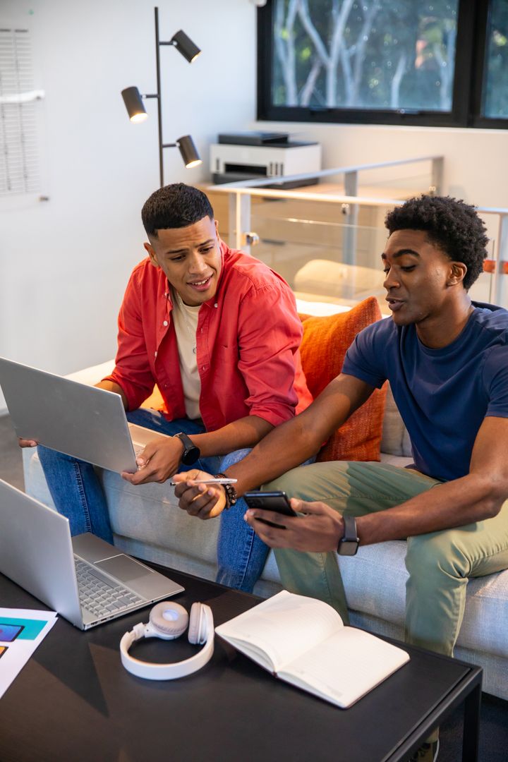 Diverse Male Friends Collaborating in Modern Home Workspace