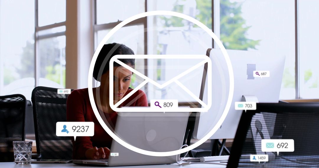 Businesswoman Managing Email Notifications in Modern Office Workspace