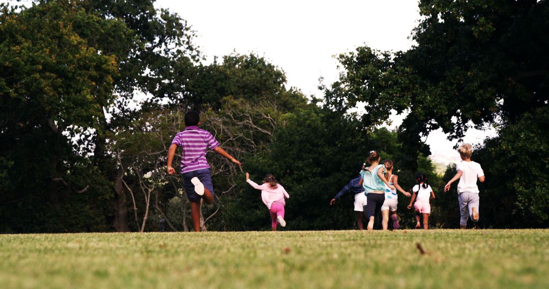 Group of Kids Running in Park on Summer Day - Free Images, Stock Photos and Pictures on Pikwizard.com