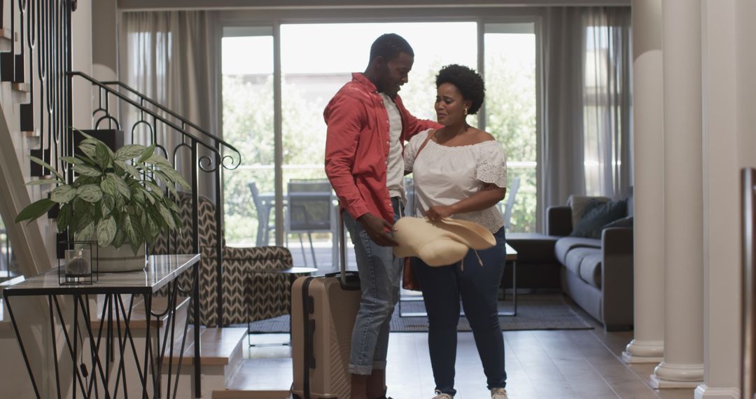 Joyful Reunion: Couple Embracing After Returning Home