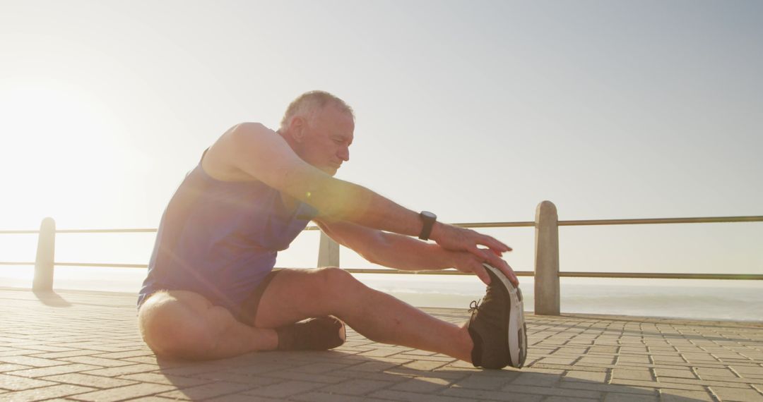 Senior Man Stretching Outdoor During Sunset - Free Images, Stock Photos and Pictures on Pikwizard.com